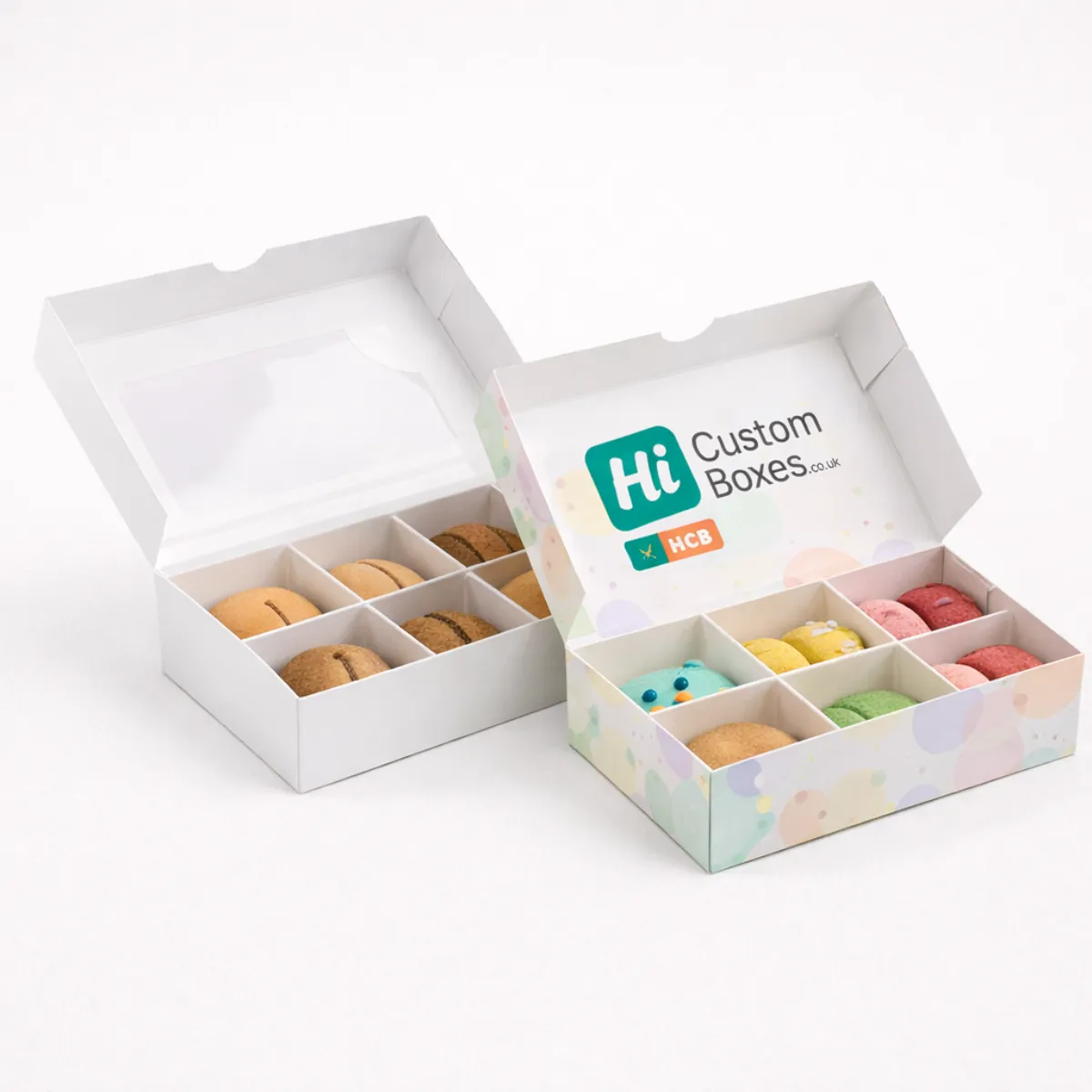 Two open white macaron boxes with dividers- one featuring a pastel-coloured polka dot design- class=